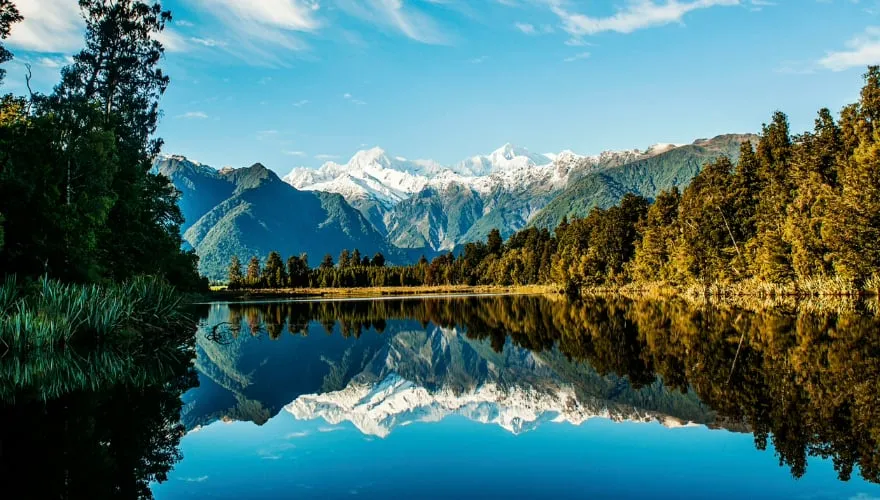 Reflections of Mount Cook and Mount Tasman in Lake Matheson, Fox Glacier, New Zealand